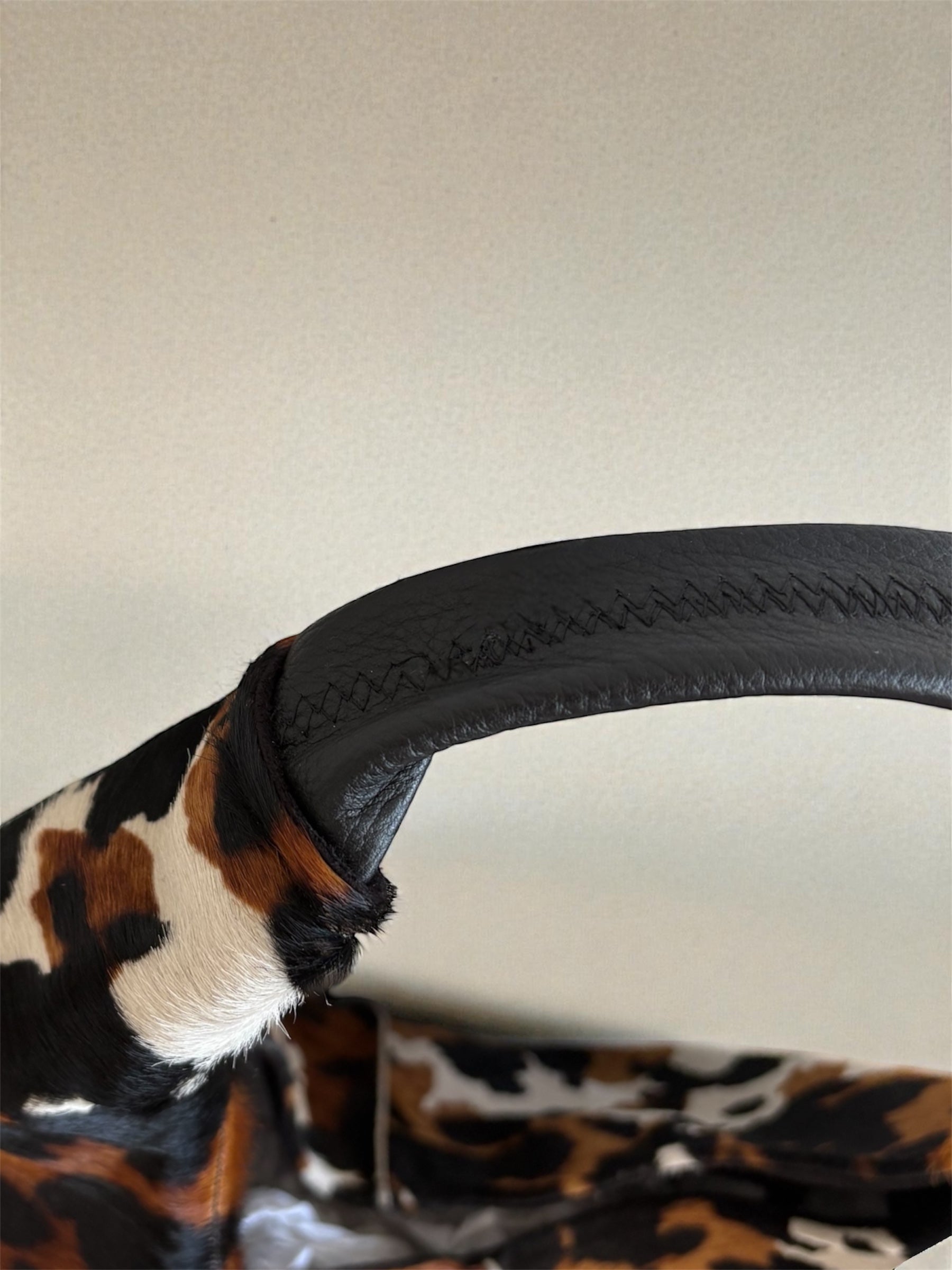 Borsa “Reborn” interamente in cavallino muccato