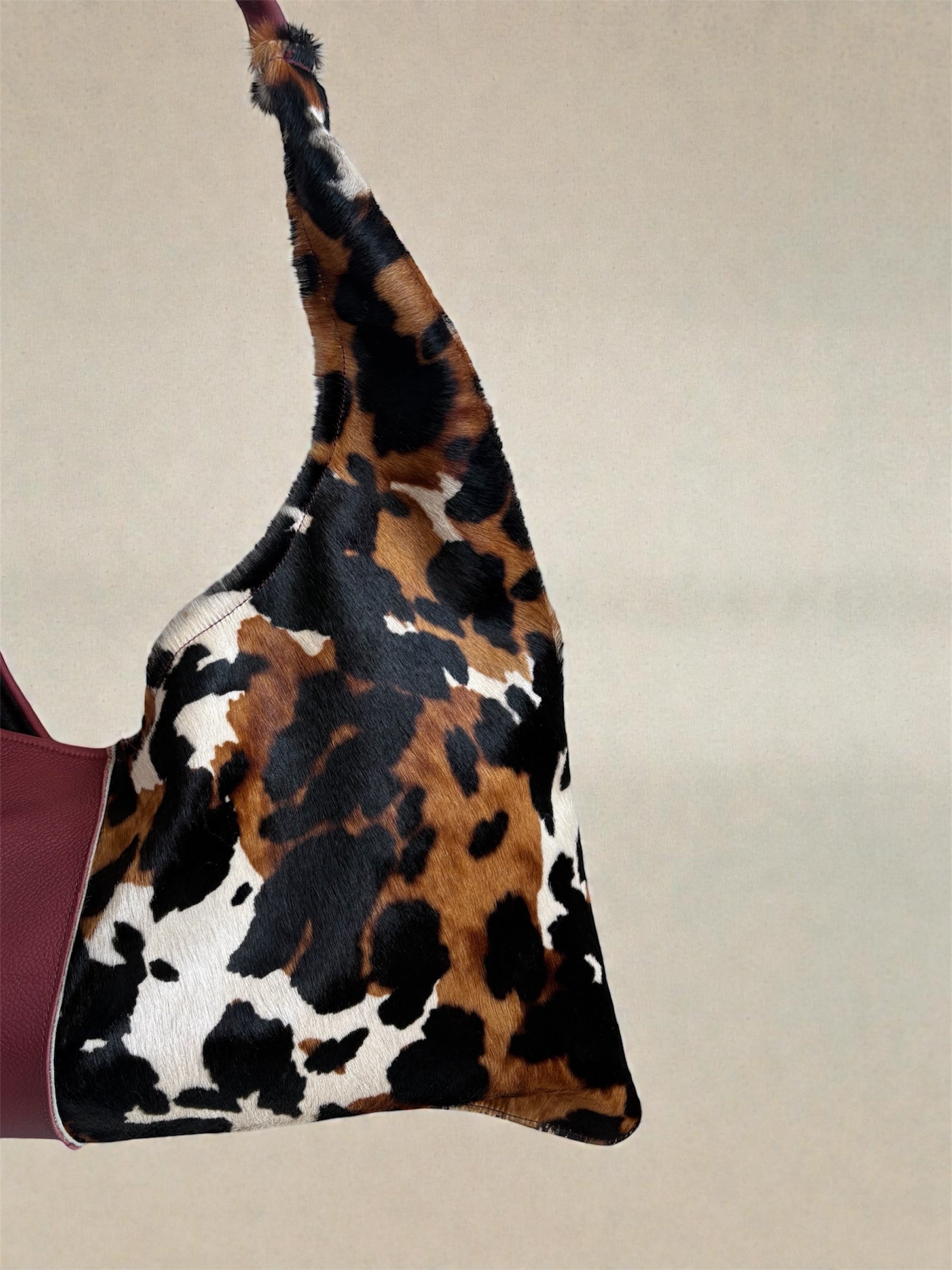 Borsa “Reborn” pelle bordeaux martellata & cavallino muccato