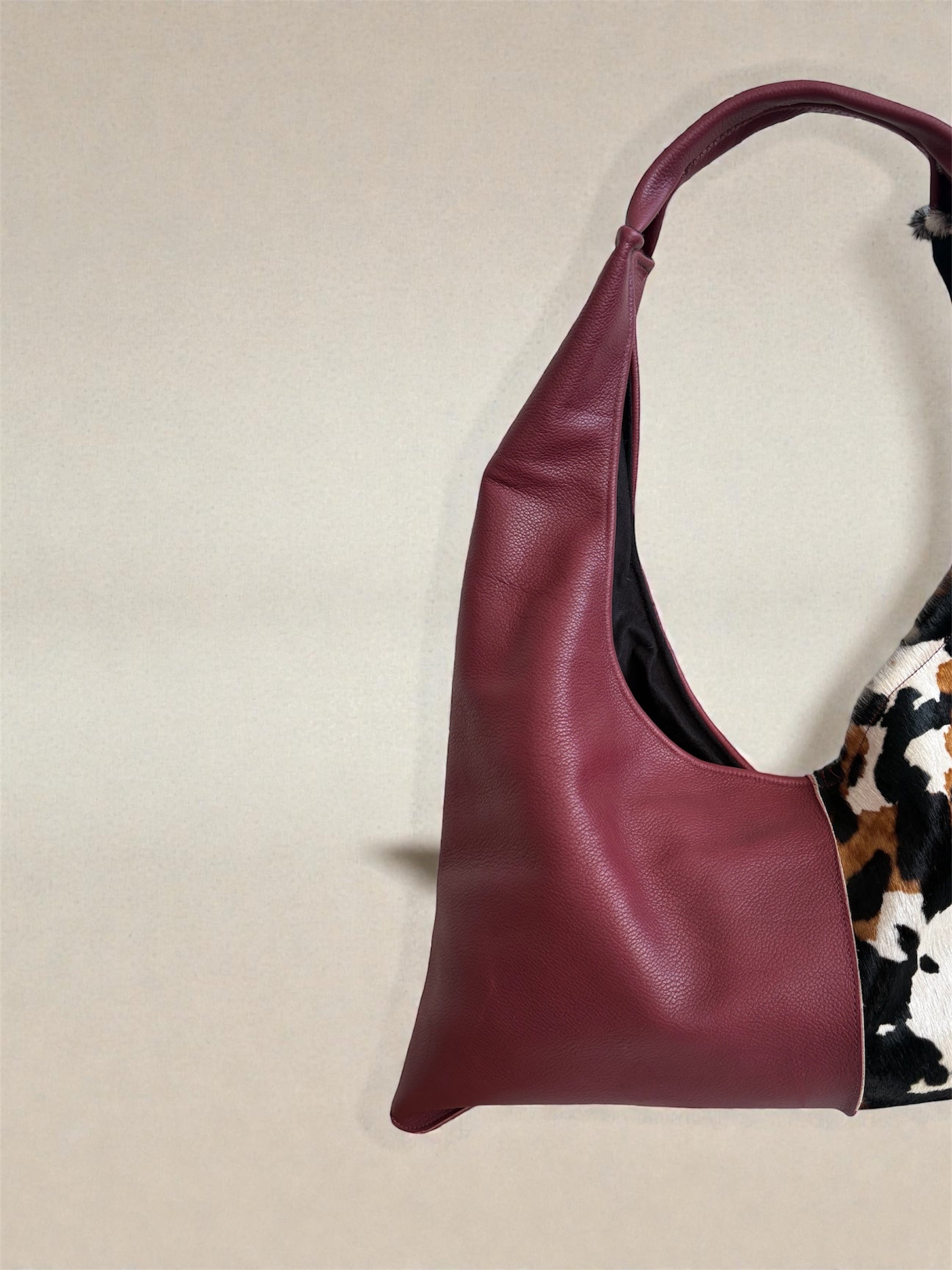 Borsa “Reborn” pelle bordeaux martellata & cavallino muccato