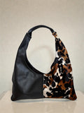 Borsa Reborn - cavallino muccato & pelle martellata nera