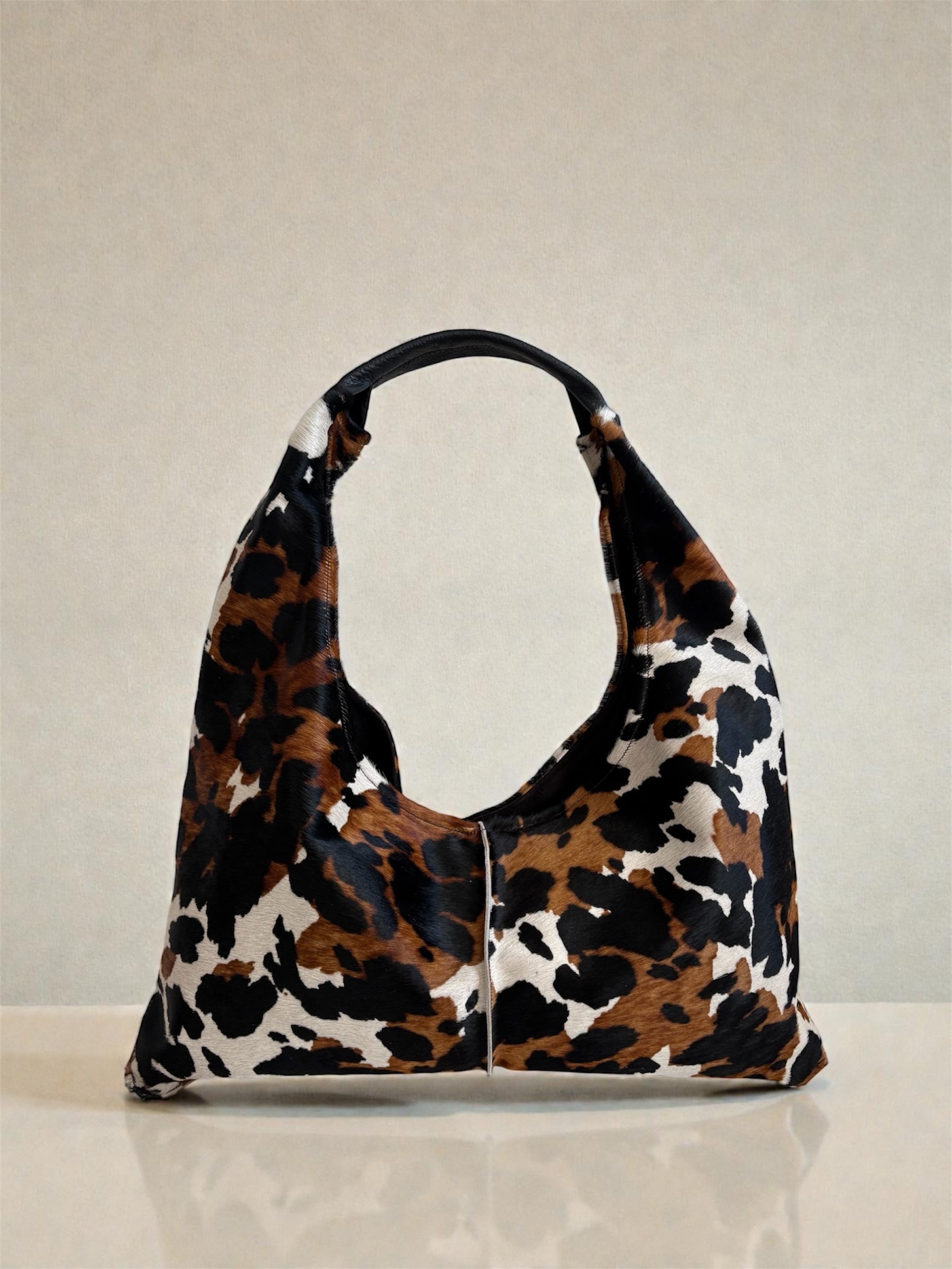 Borsa “Reborn” interamente in cavallino muccato